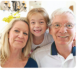 A smiling family of three